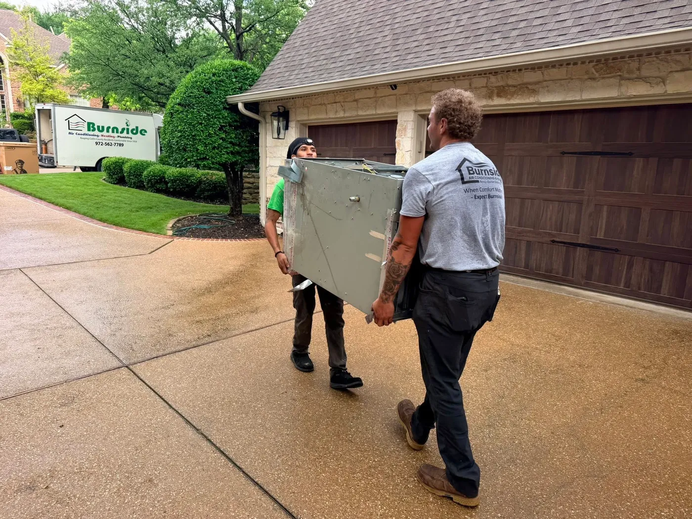 Wall-mounted tankless water heater installed by Burnside