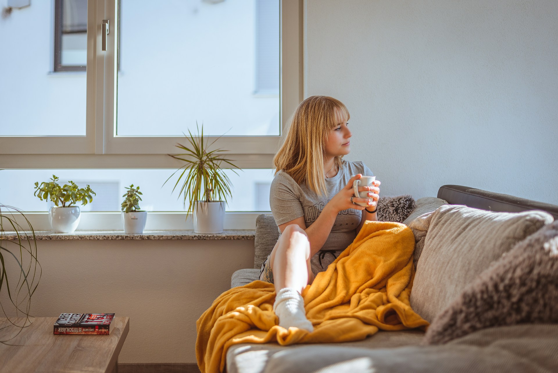 woman with blanket at home